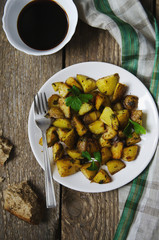 baked potatoes with sauce on a white plate