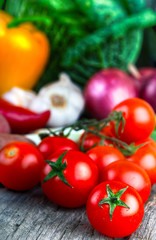 Cherry tomatoes and Fresh Organic Vegetable on wood