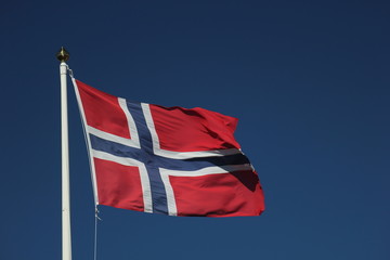 Flag of Norway on dark blue sky
