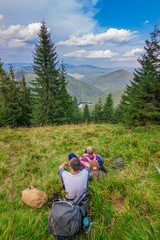 Fototapeta na wymiar Young tourist in mountains resting Synevyr Carpathians, Ukraine.