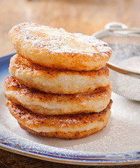 Cottage cheese pancakes sprinkled with powdered sugar
