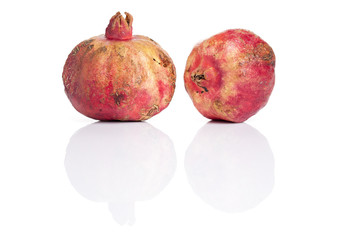 Two pomegranates on white background