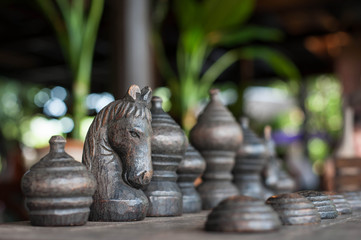 Wooden chess board with chess pieces