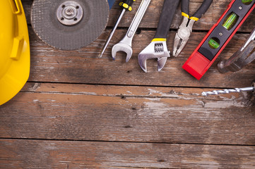 Set of tools over a wooden background