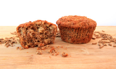Bran muffins on wooden background