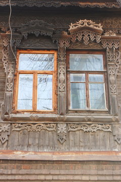 Traditional wooden Russian carved platband of an old house
