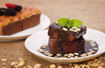 Portion of chocolate cake with mint leaf