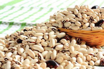Large colorful beans in a wicker basket