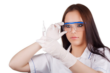 lady doctor in glasses and rubber gloves holding capsules.