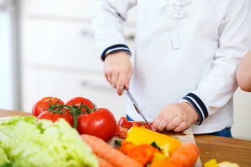 Child making salad