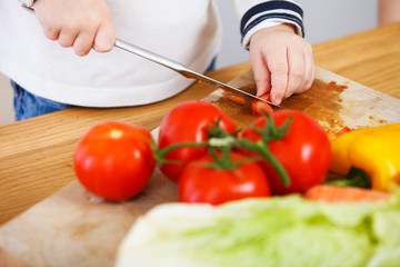 Child making salad