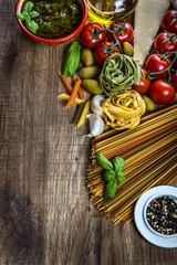 Italian and Mediterranean food ingredients on old wooden backgro