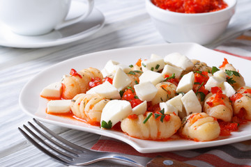 Appetizing potato gnocchi with tomato sauce and mozzarella