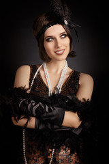 Beautiful retro woman from the roaring 20s ready to party