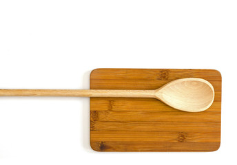 wooden cutting board with a spoon