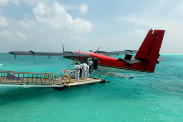Fototapeta na wymiar Seaplane at the dock of an exotic Maldives resort