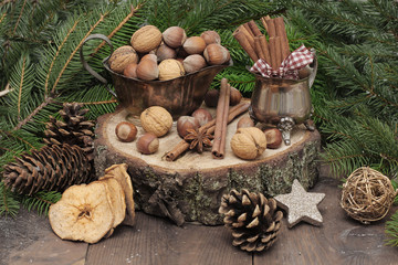 Chistmas composition with cinnamon, nuts and fir branches.