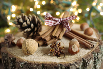 Chistmas composition with cinnamon, nuts and fir branches.
