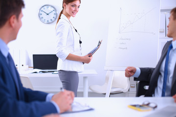 Business people sitting and discussing at business meeting, in