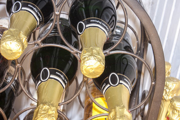 Champagne bottles, on a wine rack