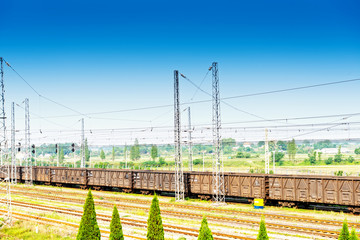 Cargo train platform at sunset with container