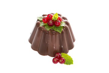 Creamy chocolate pudding with ripe currantand mint