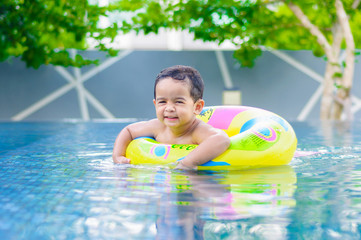 Boy in the outdoor swimming pool