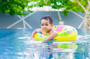Boy in the outdoor swimming pool