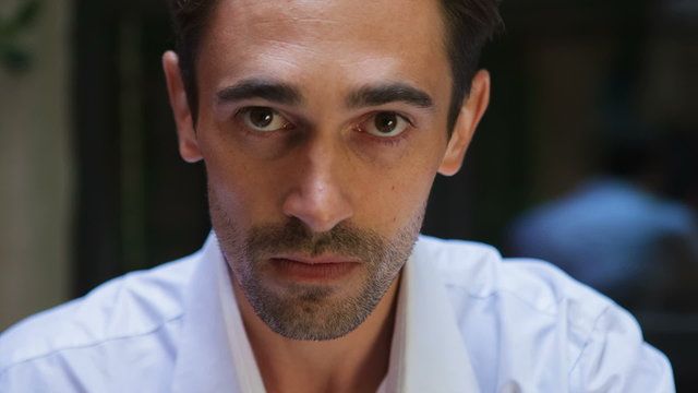 Spite on the face of a man