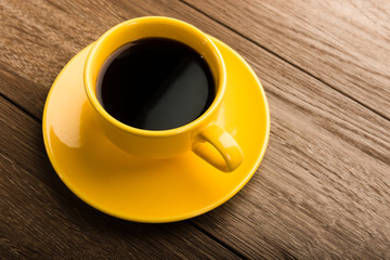 Cup of coffee on old white wooden table.