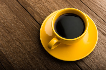 Cup of coffee on old white wooden table.