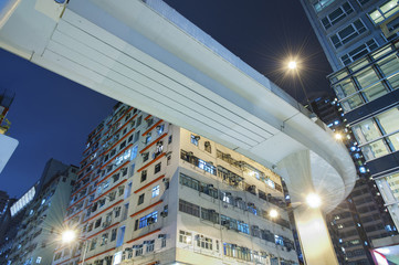 Underside of a highway with urban background