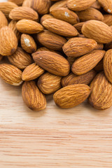 Almond on wooden background