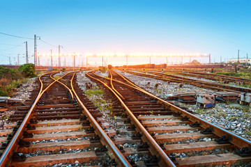 Fototapeta premium Cargo train platform at sunset with container