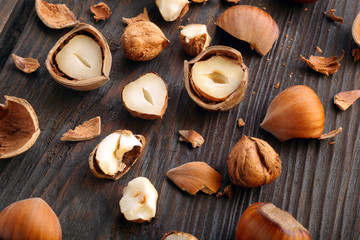 Split nuts on a wooden background
