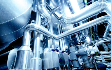 Equipment, cables and piping as found inside of a modern industr