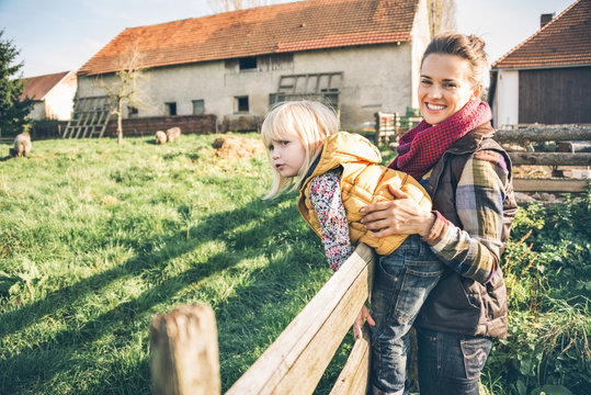 Portrait Of Happy Mother And Child On Farm