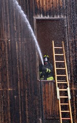 Fireman extinguish a fire with a hose