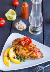 chicken fillet baked in spices and tomatoes, vegetables