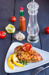 chicken fillet baked in spices and tomatoes, vegetables