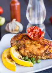 chicken fillet baked in spices and tomatoes, vegetables