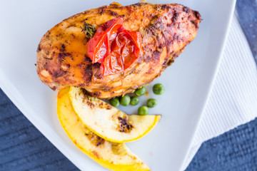 Baked chicken in a spicy sauce with vegetables