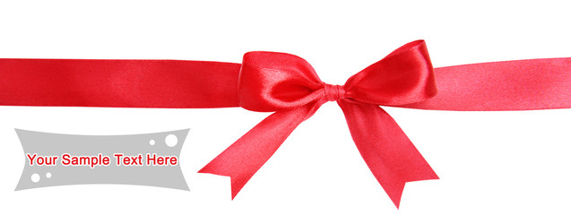 Shiny red ribbon with bow isolated on white