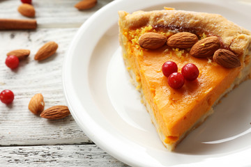 Homemade pumpkin pie on table