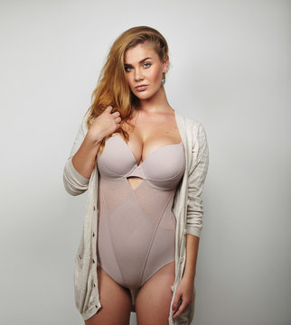 Healthy plus size woman wearing a cardigan and body stocking