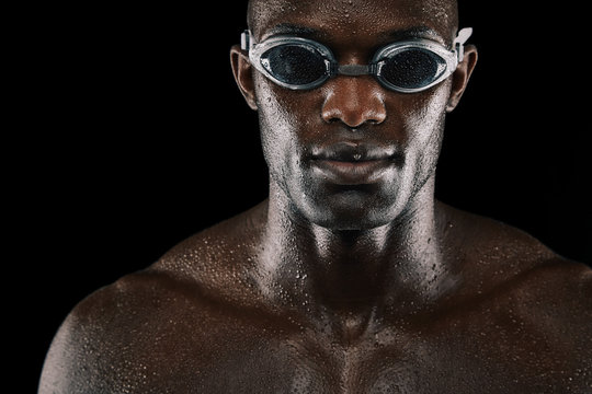 Young african man with swimming goggles