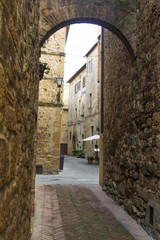 Arch on a street in an old town from Tuscany