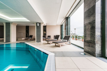 Fototapeta na wymiar Luxury swimming pool modern hotel