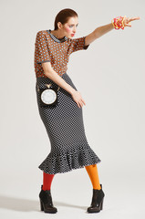 Fashion model pose on light background