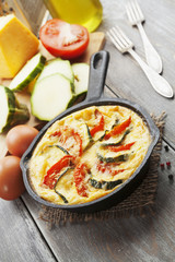 Omelette with zucchini and tomatoes